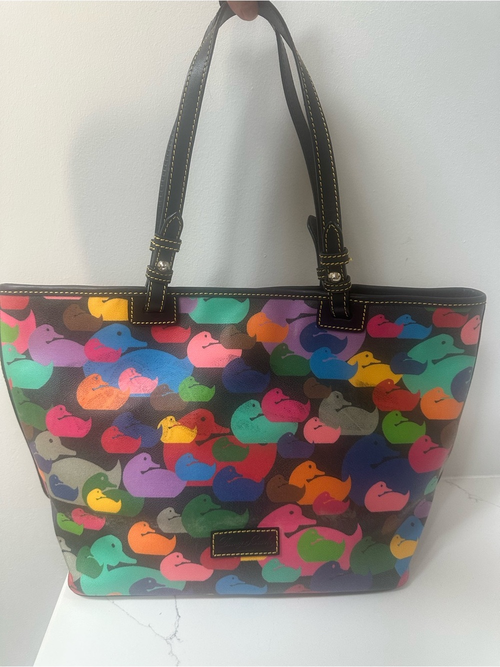 Dooney & Bourke Wonder Duck coated canvas east west tote - has color transfer